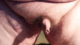Fat boys tiny penis being pushed around while standing up.
